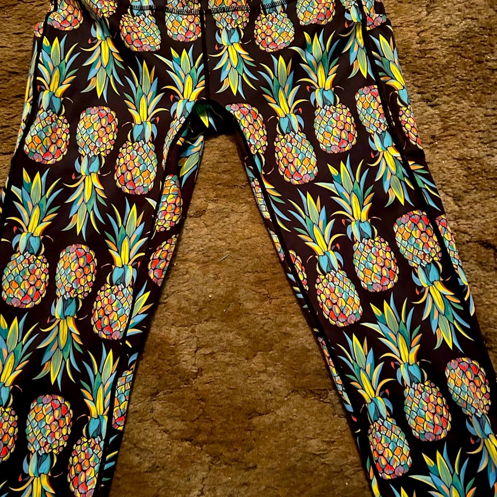 Feed Me Fight Me Pineapple Capri leggings.